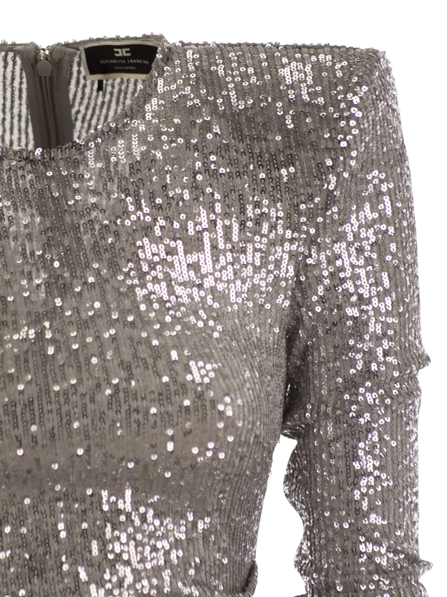 Miniabito in paillettes con gonna asimmetrica