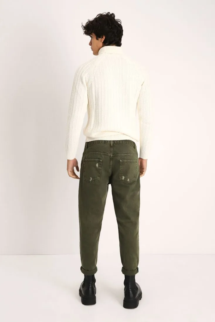 Pantaloni slim-fit monocolour con strappi e orli risvoltati