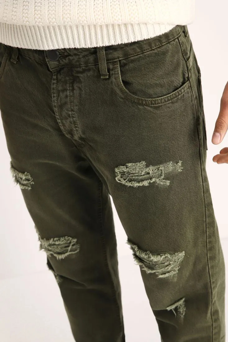 Pantaloni slim-fit monocolour con strappi e orli risvoltati