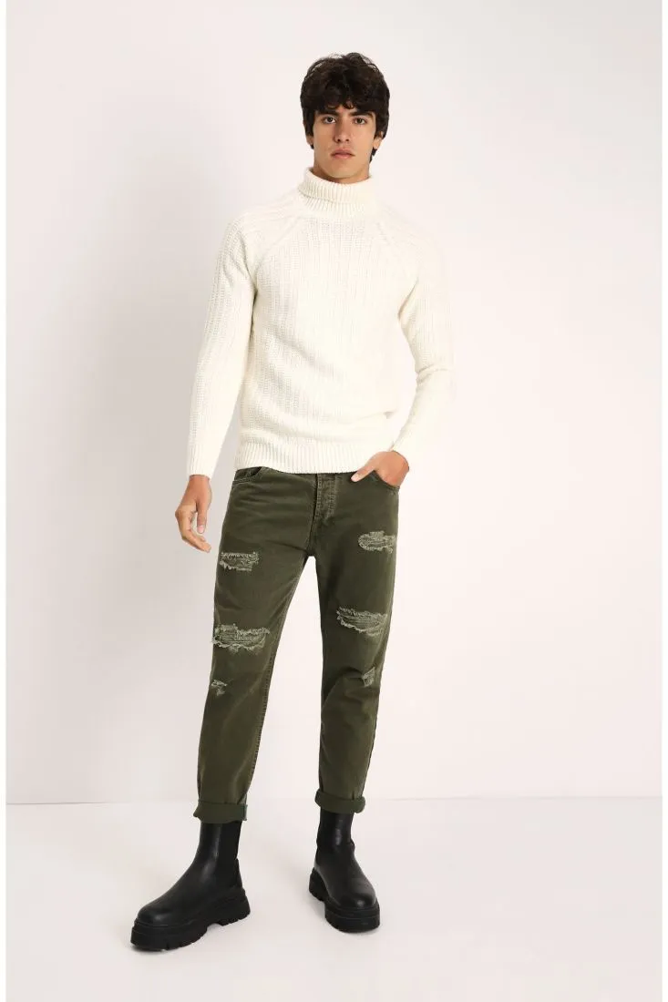 Pantaloni slim-fit monocolour con strappi e orli risvoltati